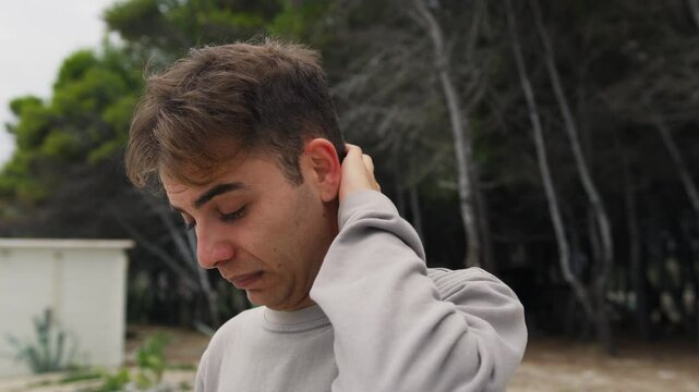 Boy Makes Intimidated And Ashamed Expression In Nature In A Park