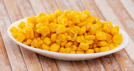 Closeup of appetizing grains boiled corn on plate