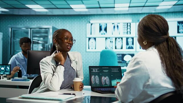 African american girl with bronchitis and a sore throat discuss with medic at the facility, uncomfortable laryngitis inflammation. Physician treating an unhealthy patient with pain. Camera B.