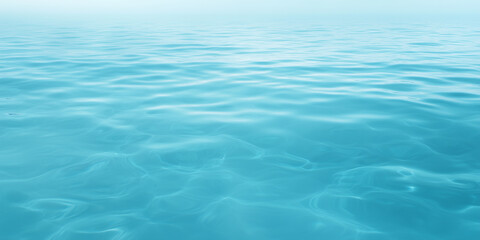 Calm turquoise water surface with gentle ripples reflecting light.