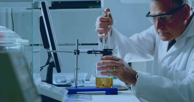 Image of network of connections over caucasian male scientist