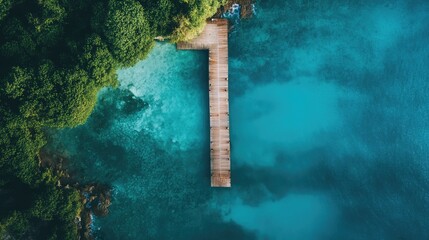 A wooden dock extending into the turquoise waters of a tropical port.