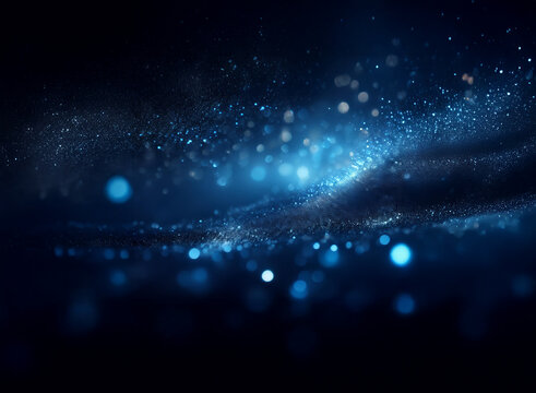 Abstract image of swirling blue particles and bokeh lights, creating a cosmic or ethereal effect.  The dark background emphasizes the luminosity of the glowing dust.