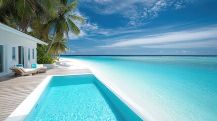 Fototapeta premium Private beachfront villa with a large wooden deck and infinity pool.