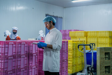 Inspector monitoring storage containers in a production facility Highlights of logistics inventory...