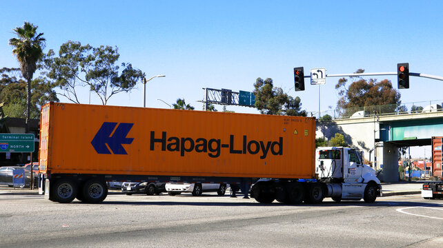 Los Angeles, California &ndash; January 13, 2025: Freight Truck carrying an HAPAG-LLOYD shipping container on a street toward the Port of Los Angeles in San Pedro