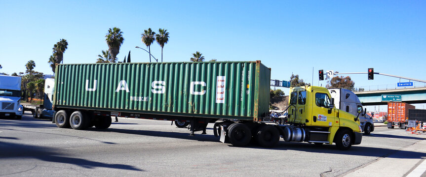 Los Angeles, California &ndash; January 13, 2025: Freight Truck carrying an UASC shipping container on a street toward the Port of Los Angeles in San Pedro