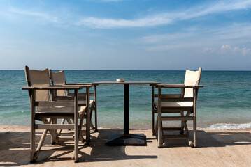 Empty table with the sea in the background