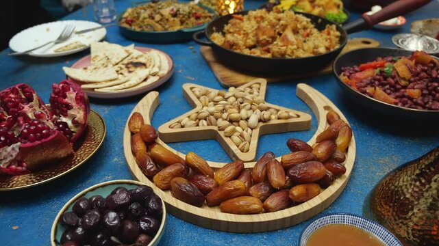 Breaking fast with dates. Iftar is the fast-breaking evening meal of Muslims in Ramadan at the time call to prayer