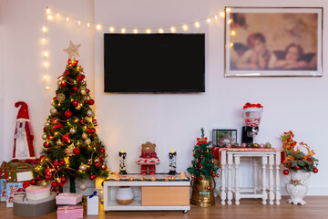 Beautiful Christmas-styled living room with Christmas tree and decorations and ornaments.