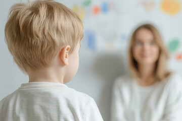 Blonde Child with Caucasian Woman in Soft Focus Background