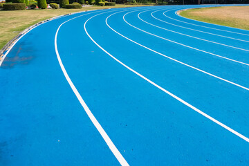 Athletics Running Track with Blue Surface and White Lane Lines Designed for Competitive Use