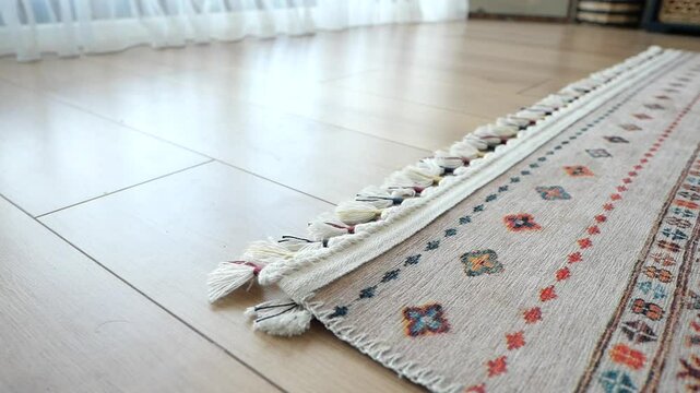Colorful oriental rug on wooden floor