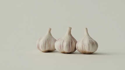 Three Garlic Cloves on a White Background