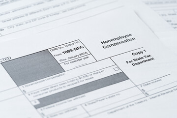 Fototapeta premium Form 1099-NEC, Nonemployee Compensation, IRS Tax Return Filing Document Close-Up