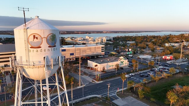 water tower with Bradenton, Florida logo at sunset near the  Manatee River
