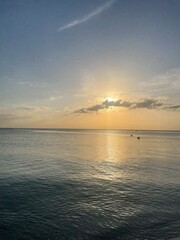Sunset over calm ocean waters