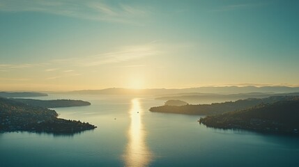 Serene Sunrise Over Tranquil Water with Mountains in the Background, Capturing the Beauty of Nature and the Calmness of a New Day