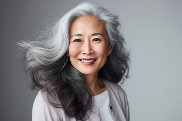 Fototapeta premium Elderly senior model asian woman portrait smiling adult.
