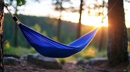 Naklejka premium Peaceful Hammock at Sunset in a Forest