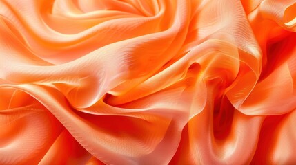 Obraz premium Close-up of undulating orange silk fabric with soft folds and highlights