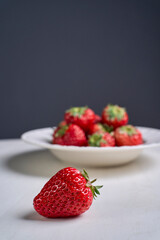 fresh strawberries in white porcelain plate