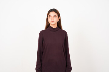 Fototapeta premium Looking aside with serious face Of Beautiful Asian Woman Isolated On White Background