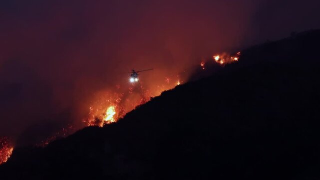 A helicopter plays a crucial role in aiding firefighting efforts in Los Angeles, effectively combating the destructive wildfires that threaten both homes and the surrounding natural landscapes