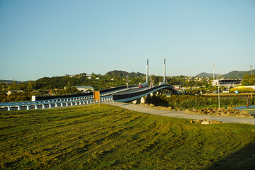 Fototapeta premium Bright morning atmosphere with blue sky around Te Matau A Pohe bridge. in Whangarei, New Zealand.
