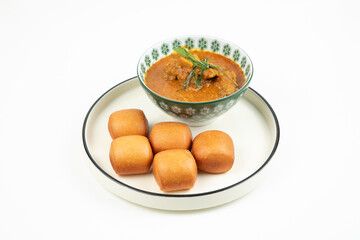 Indulge in the savory flavors of curry puffs and the soft texture of mantou, a classic dim sum pairing isolated on white background
