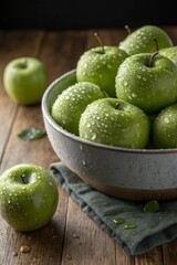 A bowl full of freshly washed green apples