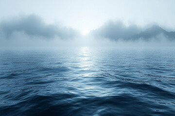 Misty Mountains Rise Above Calm Ocean Waters