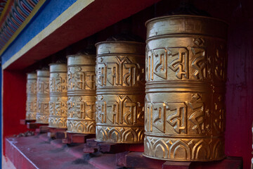 The Tibetan Prayer wheels at a Monastery 