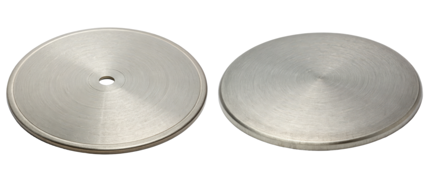 Two round brushed metal discs isolated with transparent background