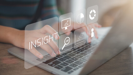 Women use a laptop with insight icons on a virtual screen. Using customer insight to build strong...