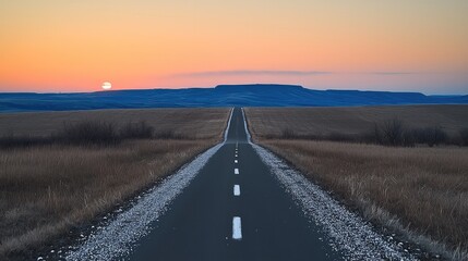 An empty countryside road at twilight.