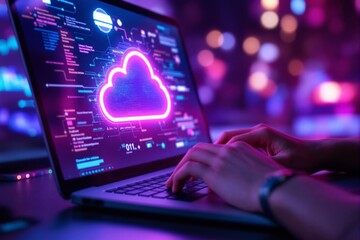 Neon cloud icon on laptop screen with coding background and hands typing on keyboard in blurred light setting.