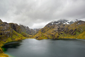 View of the lake harris with snowy mountains at the summit of the Routeburn, New Zealand