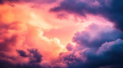 Obraz premium breathtaking display of clouds stretches across the sky, painted in hues of pink, purple, and orange as the sun sets, creating a serene and captivating twilight atmosphere