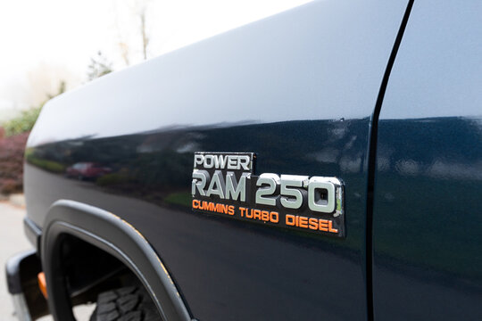 Portland, OR, USA - Nov 21, 2020 - 1992 Dark Blue Dodge Ram 250 LE Power Cummins Turbo Diesel 4x4 off-road American pickup truck SUV close up logo emblem sign. High quality picture for download