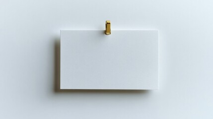 A clean rectangular white note with a gold push pin at the top, creating a classic look, isolated on white