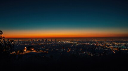 Obraz premium Los Angeles Skyline at Dusk: A Panoramic View from Griffith Observatory