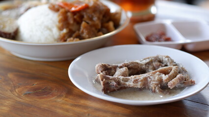 Gudeg Ceker Ayam or Gudeg Chicken Feet. Gudeg is a traditional dish from the city of Yogyakarta made from jackfruit cooked with coconut milk and palm sugar.