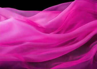 Obraz premium A soft, flowing arrangement of vibrant pink fabric, showcasing delicate textures and gentle waves against a dark background.
