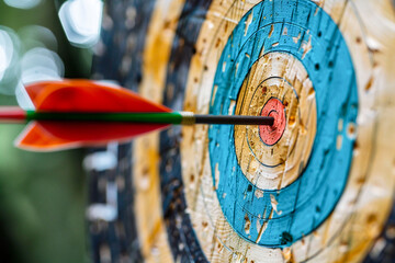 An arrow perfectly hitting the center of a colorful target, emphasizing precision, focus, and success.