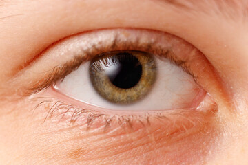 A close up of a person's eye with a blurry focus