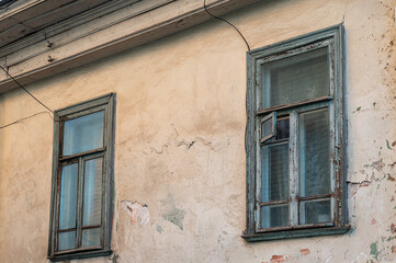Fototapeta premium The facade of old building with windows. 
