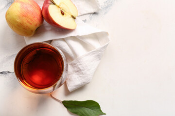 Glass of fresh apple juice on white background