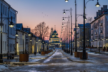 Fototapeta premium A small pedestrian street in the old town. Twilight view. Winter. 