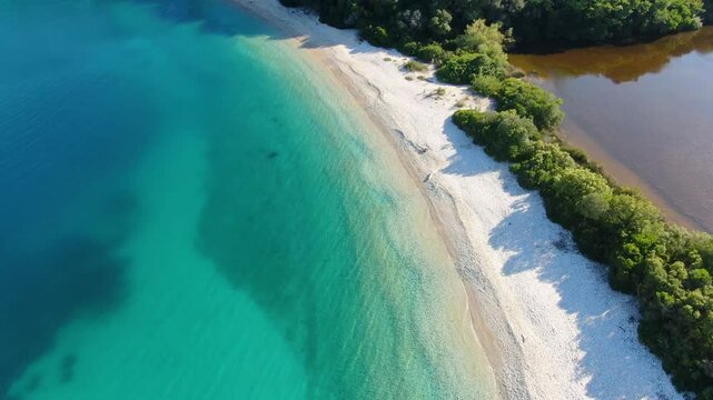 View of Erimitis coast landscape near Sinies, Kassiopi and Agios Stefanos village, Corfu island, Kerkyra, Greece, with hiking trail path, forest and beach in summer sunny day